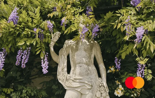 Wisteria Over Aged Stone Statue